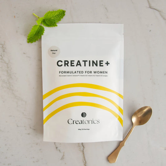 A high-quality product shot of the Creatonics Natural Unflavoured Day creatine pouch, specifically formulated for women to support strength, mind, and energy during midlife without added flavoring.