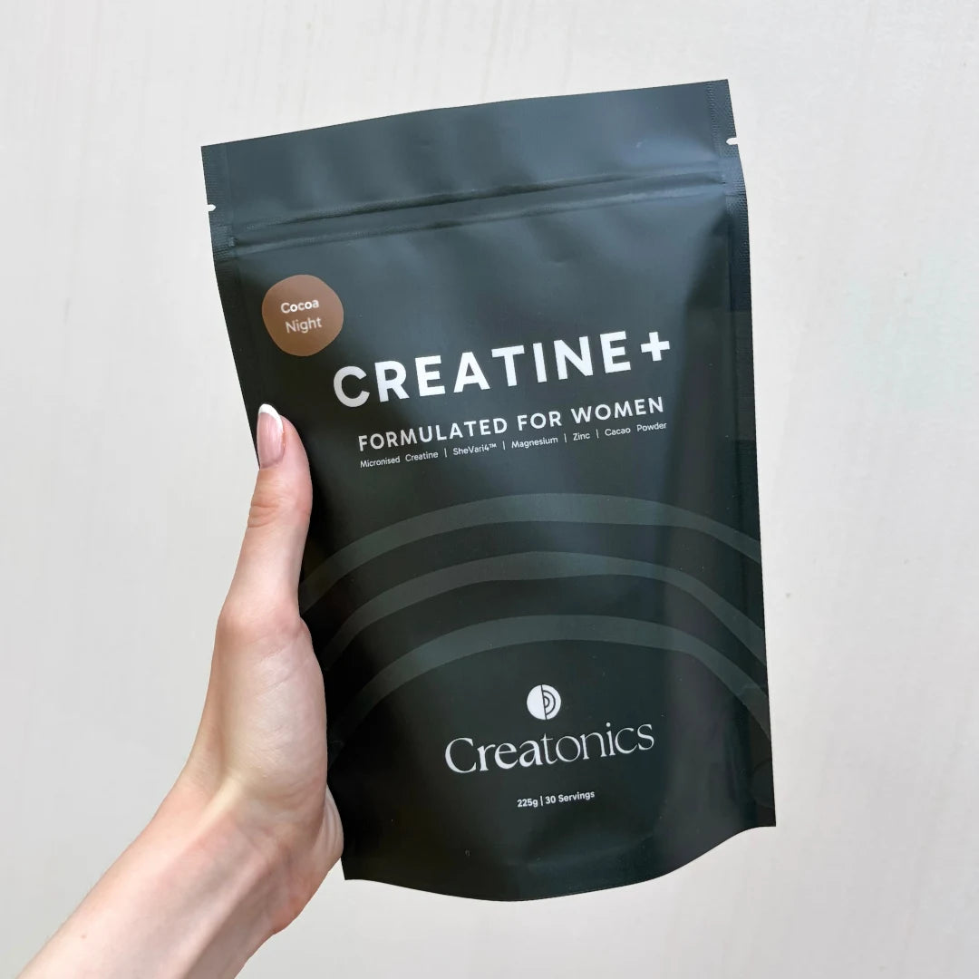 A professional product image of the Creatonics Cocoa Night creatine pouch, a nightly supplement ritual for women designed for restoration, sleep, and balance.