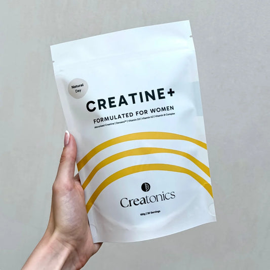 A high-quality product shot of the Creatonics Natural Unflavoured Day creatine pouch, specifically formulated for women to support strength, mind, and energy during midlife without added flavoring.