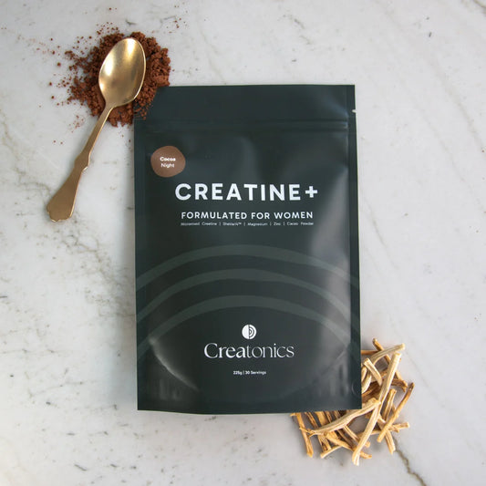 A professional product image of the Creatonics Cocoa Night creatine pouch, a nightly supplement ritual for women designed for restoration, sleep, and balance.